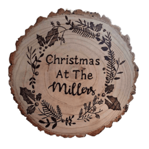 Christmas at the [Family Surname]'s: Rustic round log slice adorned with holiday decorations and surrounded by festive cheer."