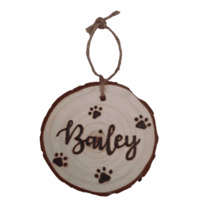 rustic hanging wood slice with hand burnt name and paw design