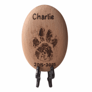 beech wood pebble with a hand burnt paw print and personalised with a name and date