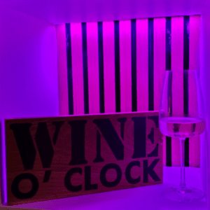 oak wood sign with hand burnt text saying 'wine o'clock'