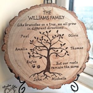 A handmade personalized family tree, hand burnt on a wood slice. The tree is in the center of the wood slice, with the family's surname and up to 10 family members' names written on the branches. The wood slice is unique, with its own markings and imperfections.