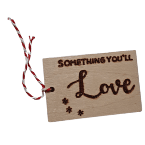 Luxury hand burnt wooden christmas gift tags saying 'something you'll love'