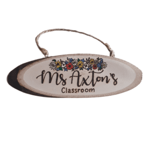 handmade wooden personalised log plaque with hand burnt teacher name and a colourful floral design