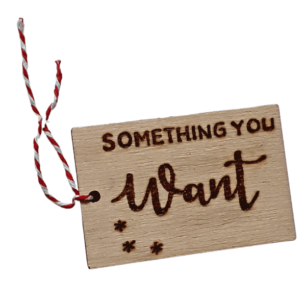 Luxury hand burnt wooden christmas gift tags saying 'something you want'