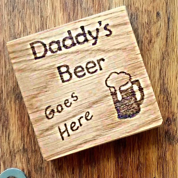 oak square coaster which reads 'daddys beer goes here' and with a hand burnt beer mug design