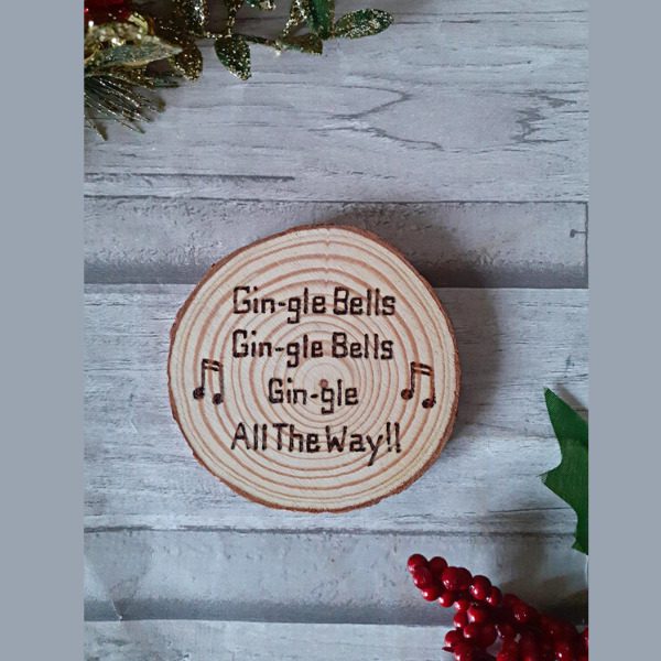 handmade wooden christmas coaster. Says 'gin-gle bells, gin-gle bells, gin-gle all the way'