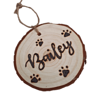 rustic hanging wood slice with hand burnt name and paw design