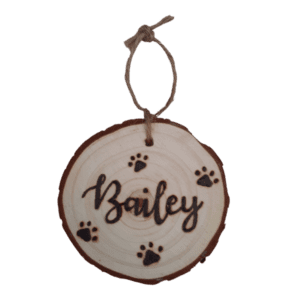 rustic hanging wood slice with hand burnt name and paw design