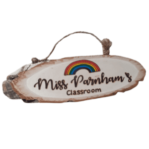 handmade wooden personalised log plaque with hand burnt teacher name and a colourful rainbow