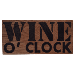 oak wood sign with hand burnt text saying 'wine o'clock'