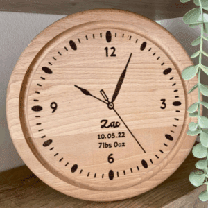 A hand burnt personalised wooden clock for a babies room. Hand burnt with babies name, date of birth, weight and time showing time of birth